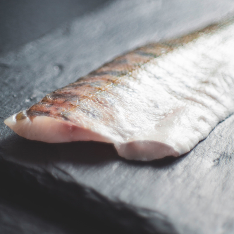 Fresh cod fillet on a slate board
